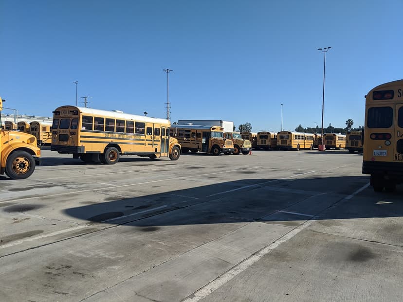 Yellow school bus fleet parked at a depot